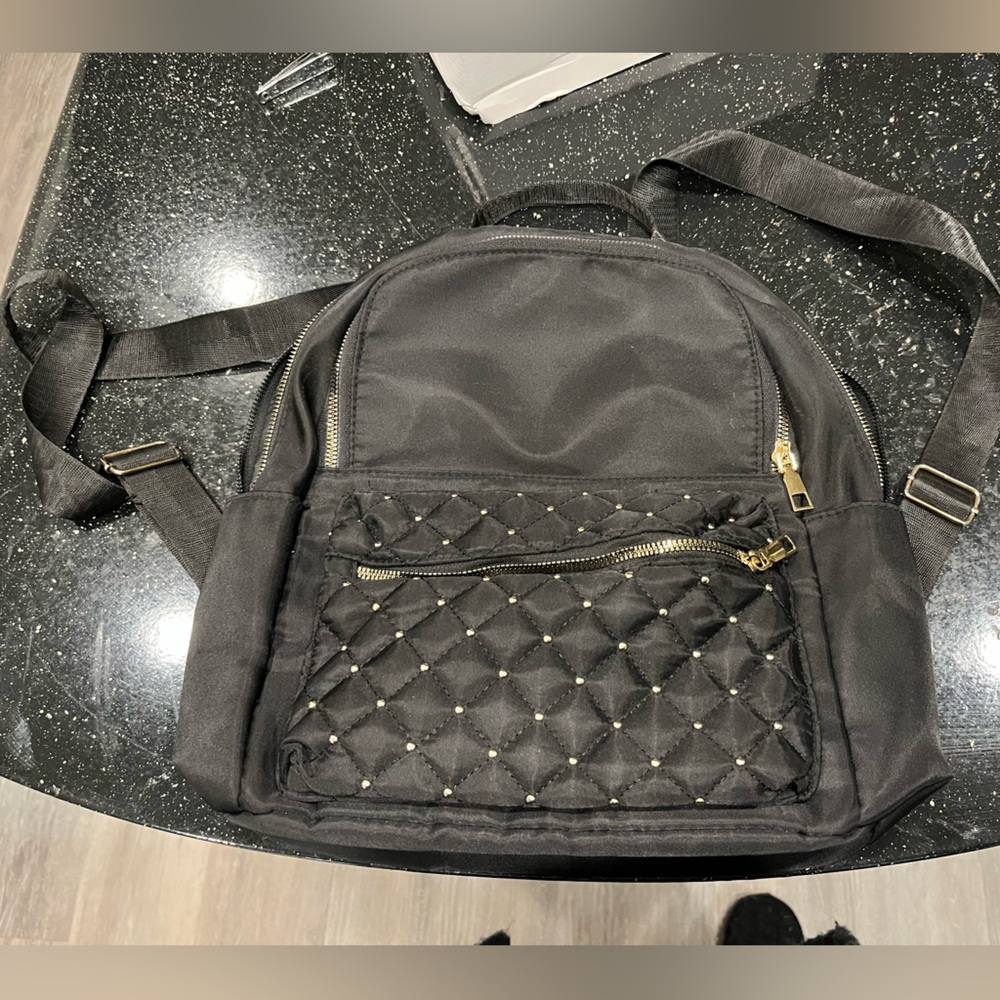 Elegant Black Quilted Bag with Gold Details